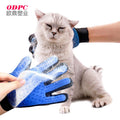 Cat being groomed with the blue and black Pet Cat Cleaning Hair Remover glove